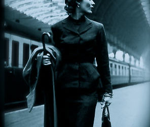 Who is the woman at the train station?